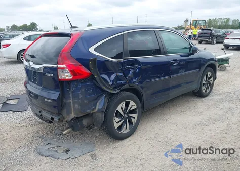 2016 Honda Cr-V Touring z USA, uszkodzony, nr VIN 5J6RM4H99GL120730